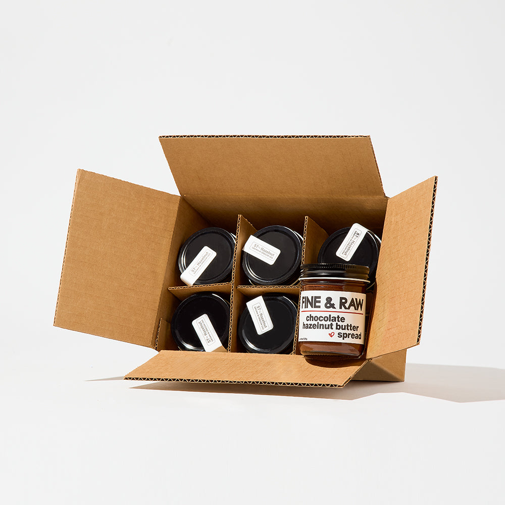 Jar of organic bean to bar chocolate Hazelnut Butter Spread by FINE & RAW organic bean to bar chocolate