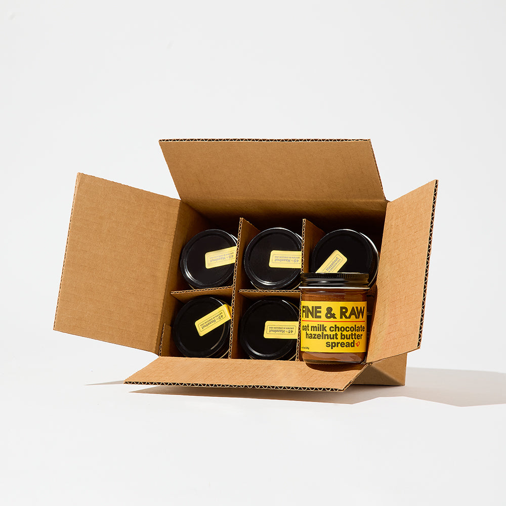 Jar of Oat Milk organic bean to bar chocolate Hazelnut Butter Spread by FINE & RAW organic bean to bar chocolate