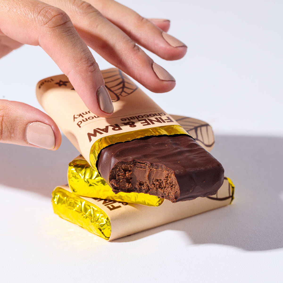Almond Chunky by FINE & RAW organic bean to bar chocolate, styled product photo