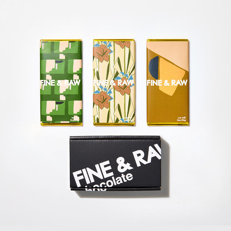 trio of chocolate bars and black box